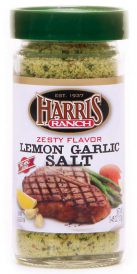 s_lemon_garlic_salt Unopened container of Harris Ranch Zesty Flavor Lemon Garlic Salt. Clear bottle with green lid. Spices are yellow and green.