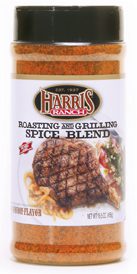 s_roasting_grilling_spice_blend Unopened container of Harris Ranch Roasting and Grilling Spice Blend. Clear bottle with black lid. Spices are red-orange